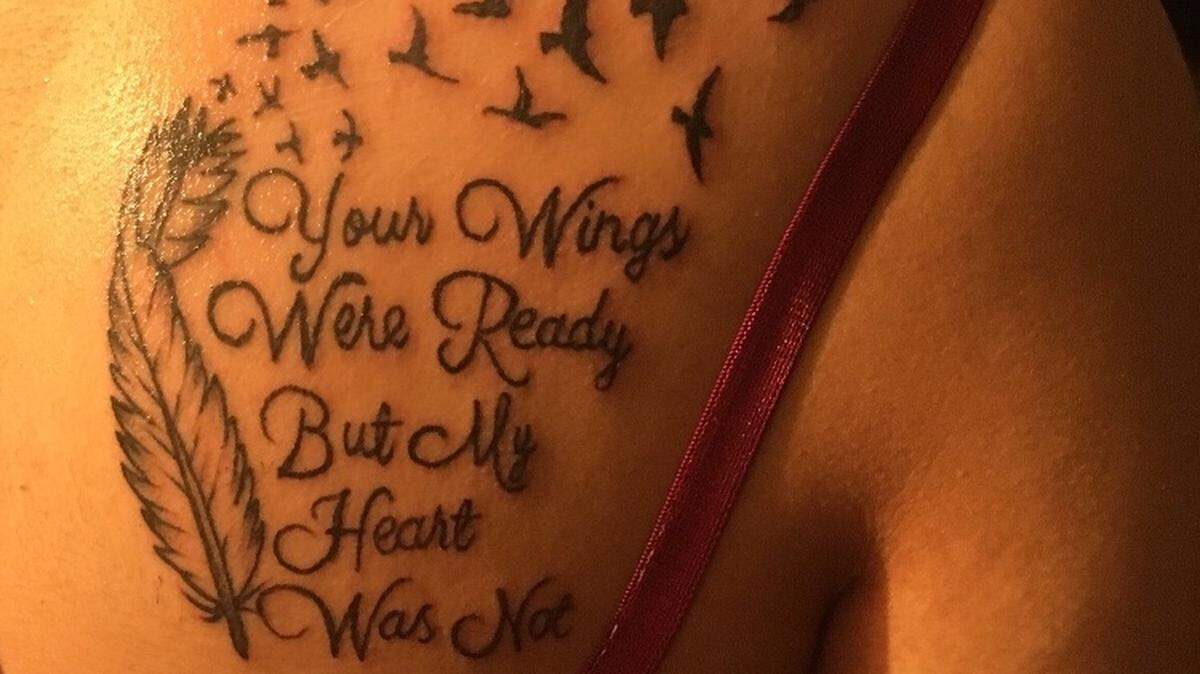 “Your Wings Were Ready But My Heart Was Not,” reads Julia Fuentes’ shoulder tattoo dedicated to her late father.