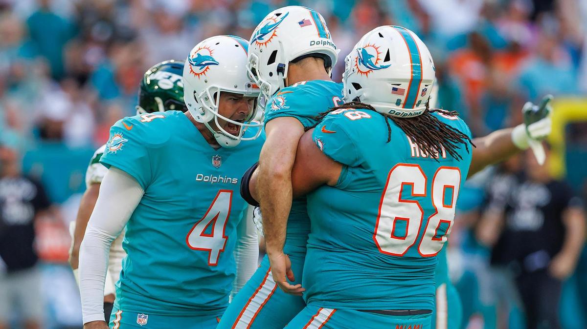 Miami Dolphins place kicker Jason Sanders (7) celebrate with teammates Thomas Morstead (4) and Robert Hunt (68) after kicking the winning field goal during fourth quarter of an NFL football game against the New York Jets at Hard Rock Stadium on Sunday, January 8, 2023 in Miami Gardens, Florida.