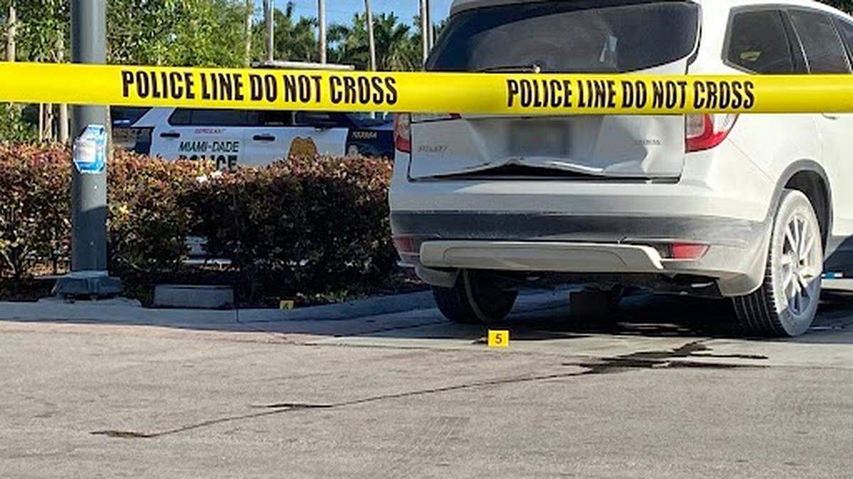 Evidence markers lie underneath crime scene tape in the parking lot of a Wawa store on Southwest 248th Street in Miami-Dade County on Monday, April 7, 2025, after a man was shot and killed in the parking lot.