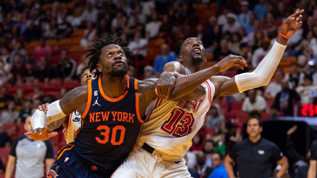 Miami Heat center Bam Adebayo (13) fights for the rebound with New York Knicks forward Julius Randle (30) during the fourth quarter of an NBA game at Miami-Dade Arena Downtown Miami, Florida, on Wednesday, March 22, 2023.