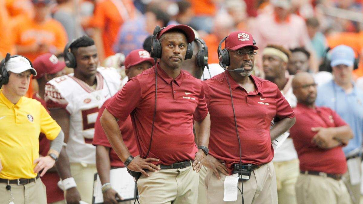 Florida State head coach Willie Taggart watches a replay in the fourth quarter of an NCAA college football game against Syracuse in Syracuse, N.Y., Saturday, Sept. 15, 2018.