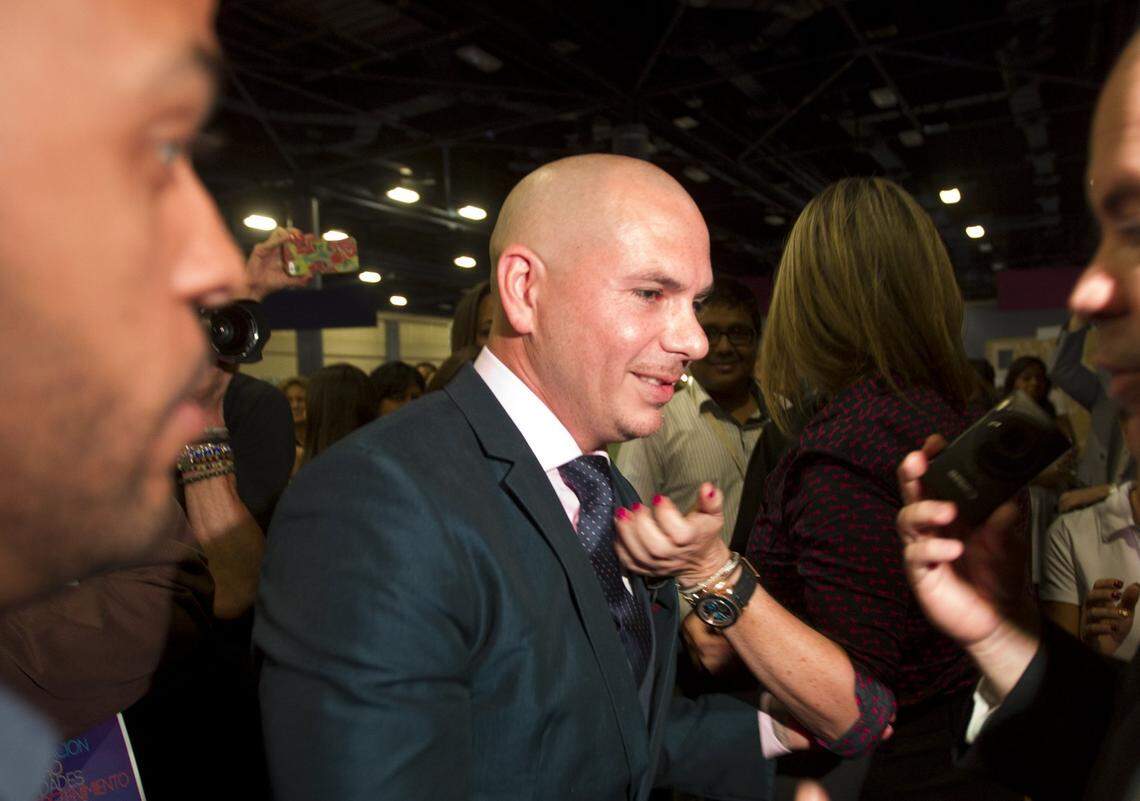 Pitbull aka Armando Christian Perez, walks through a crowd of after taking the stage for a conversation with Manny Medina, the founder of eMerge Americas. eMerge Americas TechWeek Summit took place at the Miami Beach Convention Center