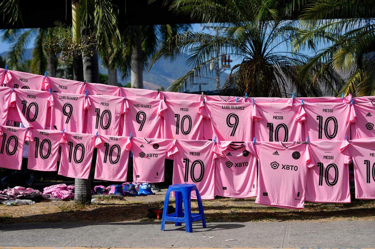 Jerseys of Inter Miami’s Lionel Messi and Luis Suarez are displayed for sale outside the Cuscatlan stadium prior to a friendly soccer match between El Salvador’s national team and Inter Miami, in San Salvador, El Salvador, Friday, Jan. 19, 2024. (AP Photo/Moises Castillo)