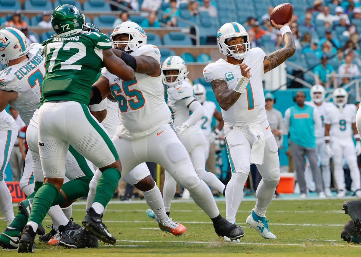 Miami Dolphins quarterback Tua Tagovailoa (1) sets up to pass against the New York Jets in the first half of their NFL football game at the Hard Rock Stadium in Miami Gardens, Florida on Sunday, December 8, 2024.