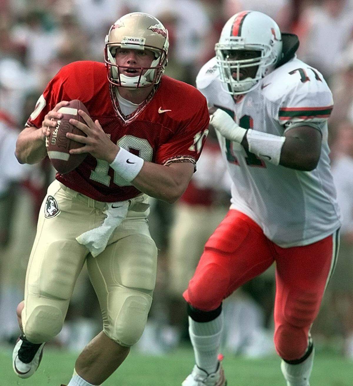 In 1997, the University of Miami Hurricanes vs. Florida State Seminoles at Doak Campbell Stadium in Tallahassee. FSU backup QB Dan Jendra scrambles away from UM DE Derrick Ham late in the third quarter.