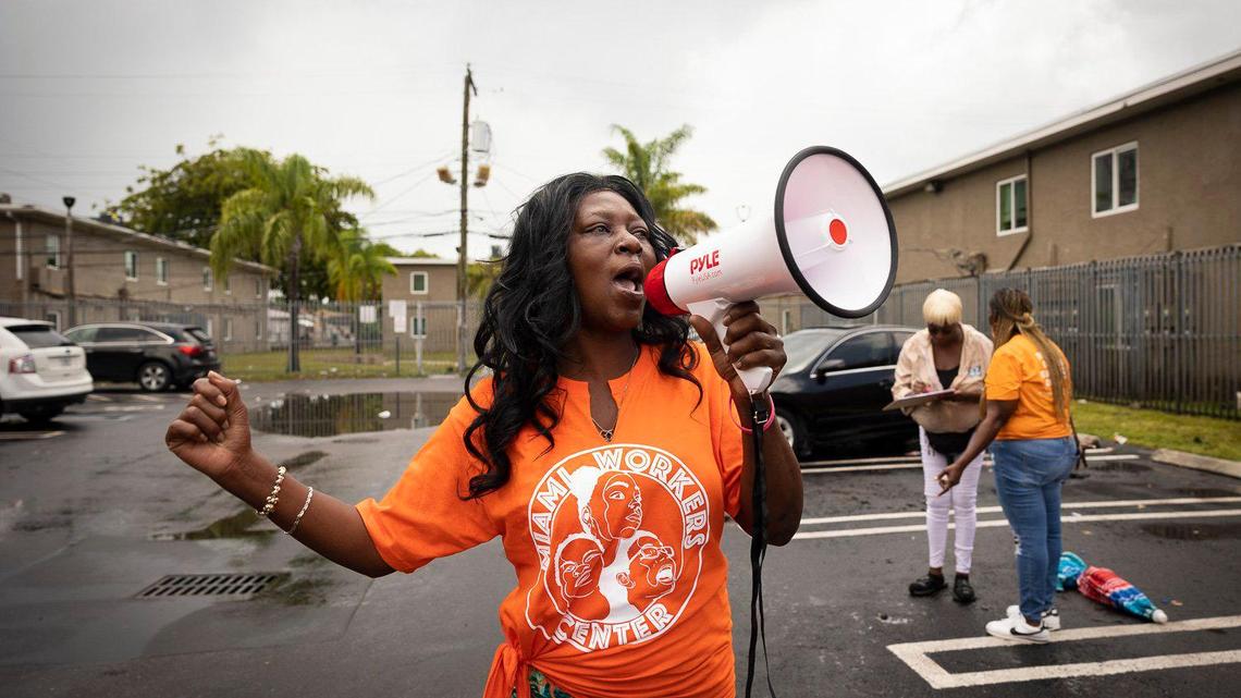 Sedrika Jacques, tenant at Lincoln Fields Apartments, shouts “wake up Lincoln field residents!” Before a press conference outside of the income-based housing apartments on Tuesday, May 23, 2023, down the street from Liberty Square in Miami.
