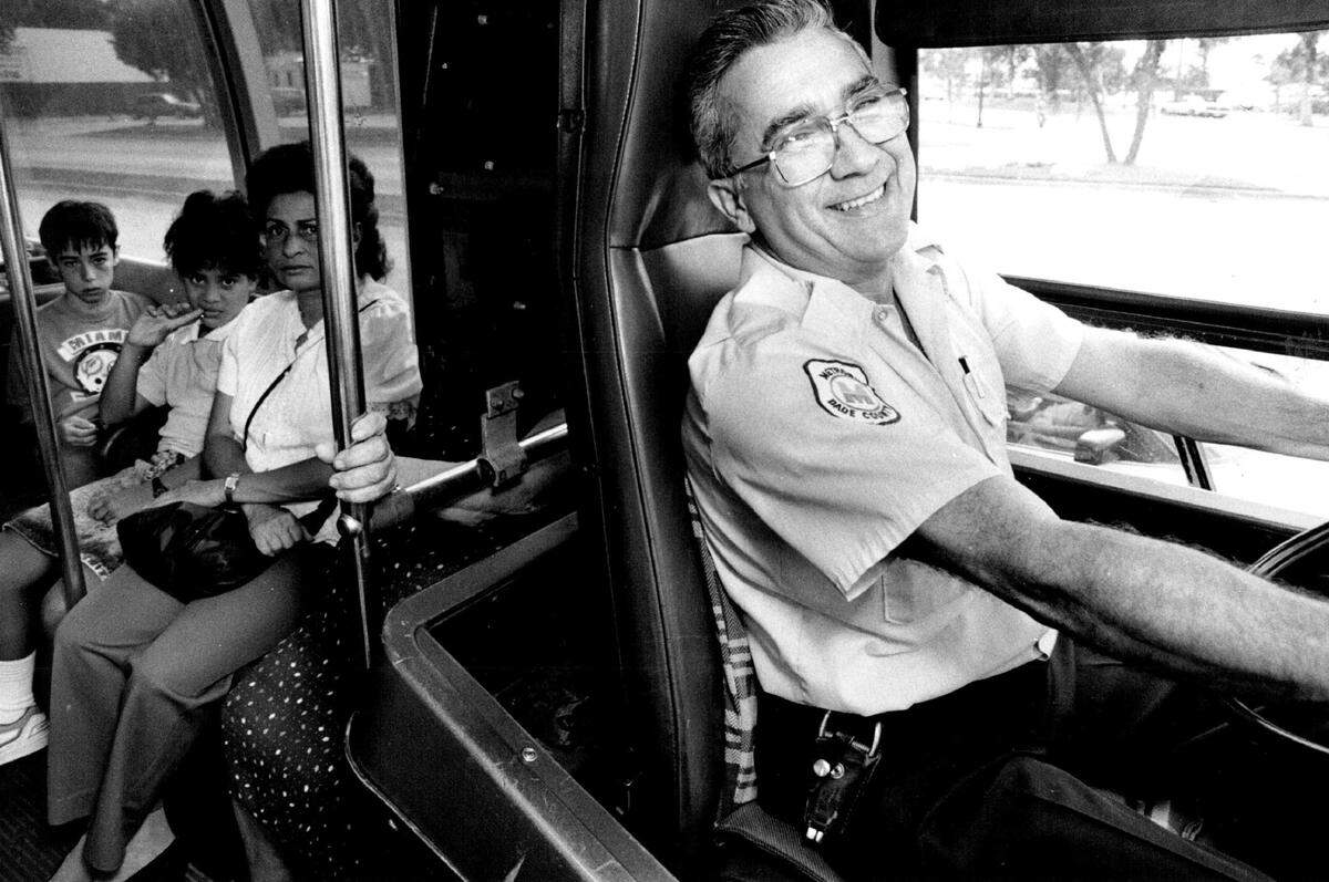 C bus route driver Abel Correa picks up passengers in Miami Beach in 1988.
