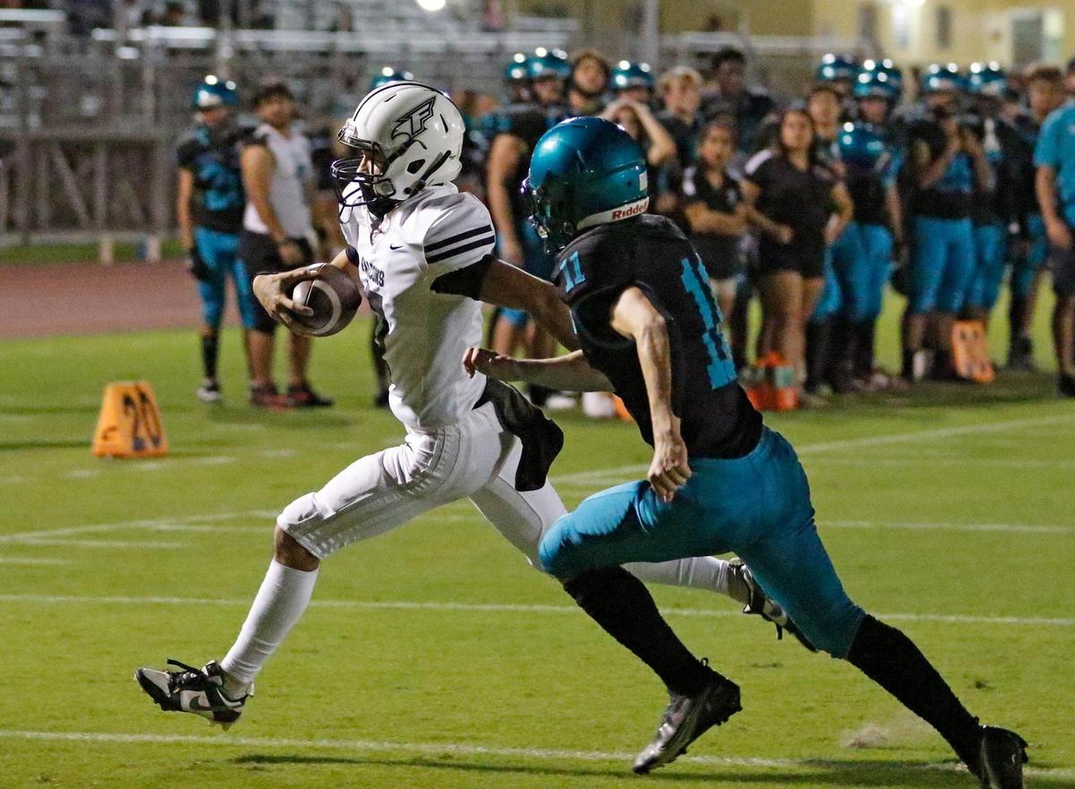 Ferguson Falcons quarterback Alex Lamela carries the ball against Coral Reef Barracudas during the GMAC Independent Conference title football game on Thursday, November 14, 2024 at Southridge HS in Miami. Andrew Uloza / for Miami Herald