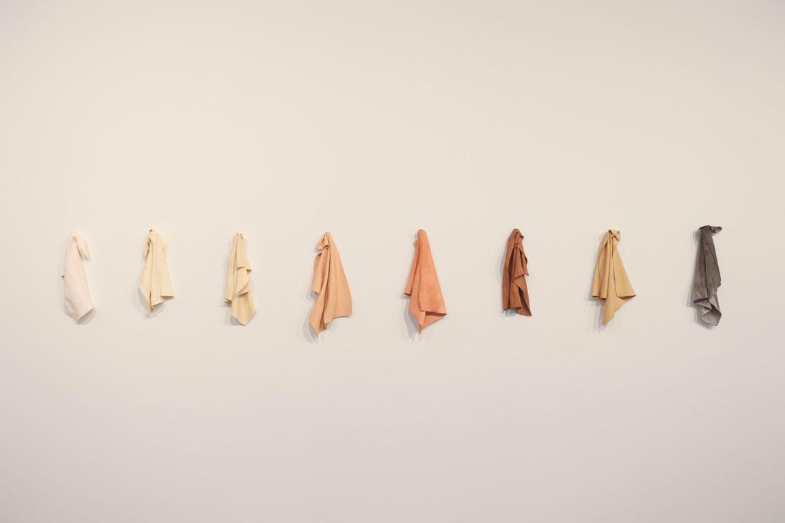 ‘Auburn, Colored China Rags’ by Juana Valdés hang on the wall at Espacio 23. The rags are made from bone china. The material is typically associated with the wealthy. “However, this work hints on how people of all different skin tones and all types of individuals are involved with the material - whether they’re eating from it or serving it,” said one of the curators.