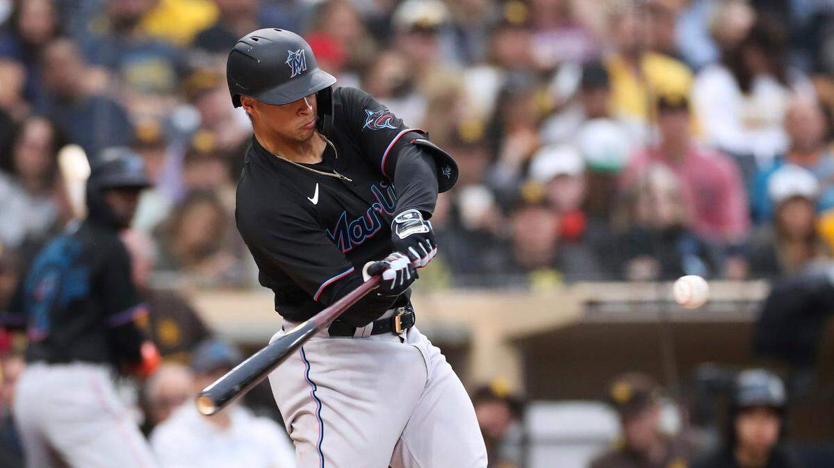 Miami Marlins’ Joe Dunand hits a solo home run against San Diego Padres’ Sean Manaea in the third inning of a baseball game Saturday, May 7, 2022, in San Diego. The home run was Dunand’s first career hit.