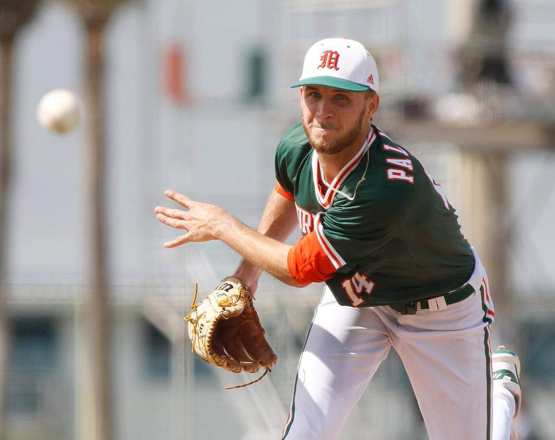 UM Hurricanes starting pitcher Carson Palmquist (14) delivers a pitch during the NCAA baseball regional game against Ole Miss Rebels on Sunday, June 5, 2022 at Alex Rodriguez Park at Mark Light Field in Coral Gables. Andrew Uloza / for THE MIAMI HERALD