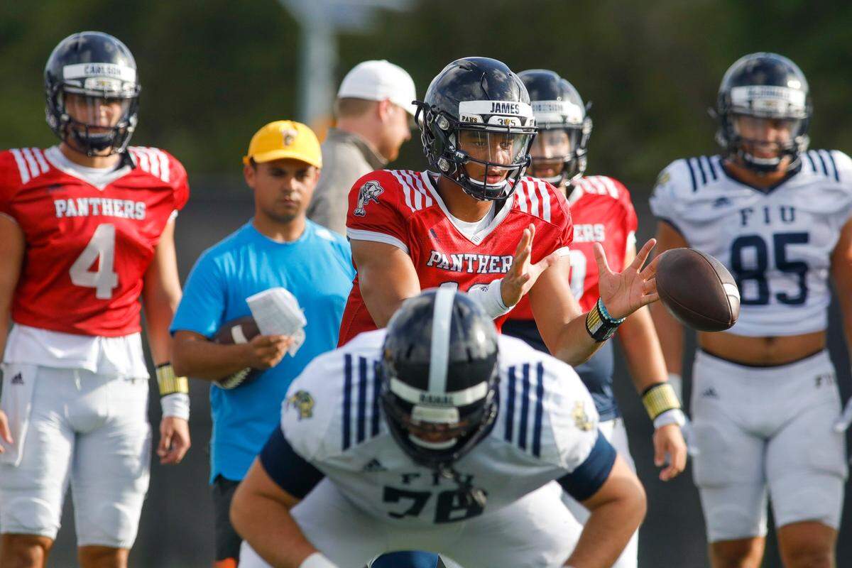Florida International University quarterback Grayson James (10) gets the snap during football practice at the practice fields at Florida International University in Miami, Florida, on Thursday, March 24, 2022.