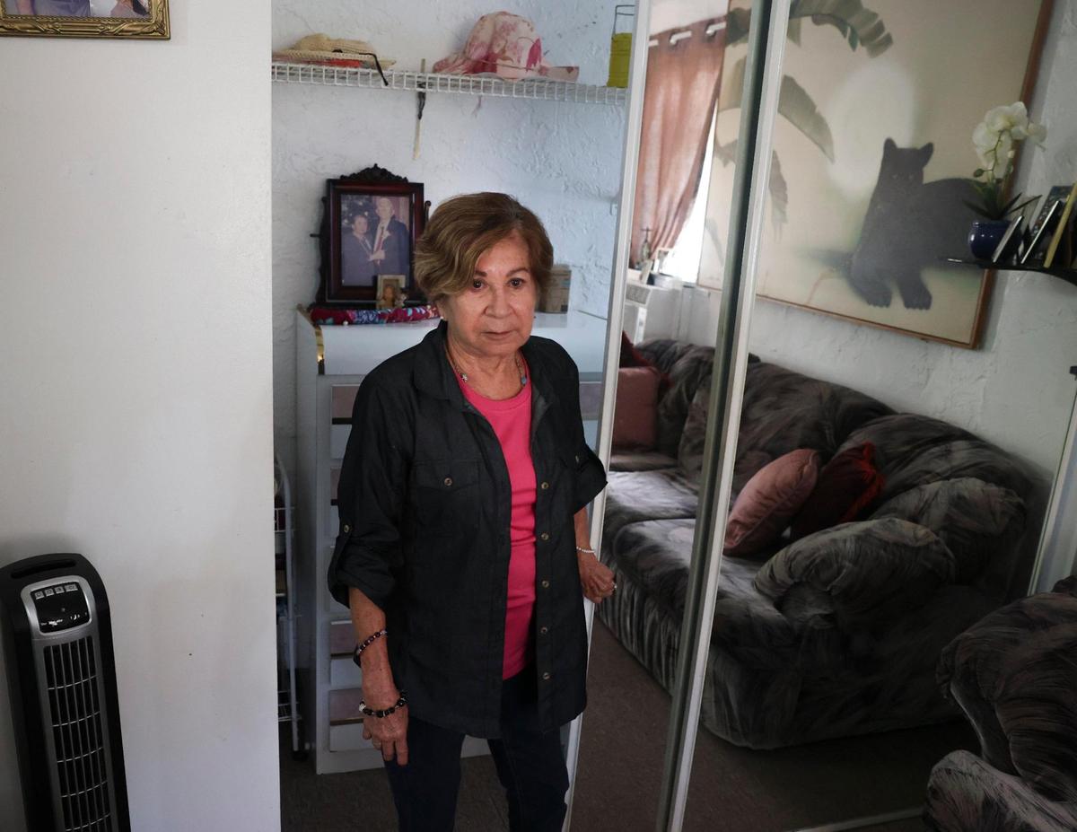 Carmen Gonzalez stands in her empty closet at Shep Davis Apartments on Sept. 15, 2022.