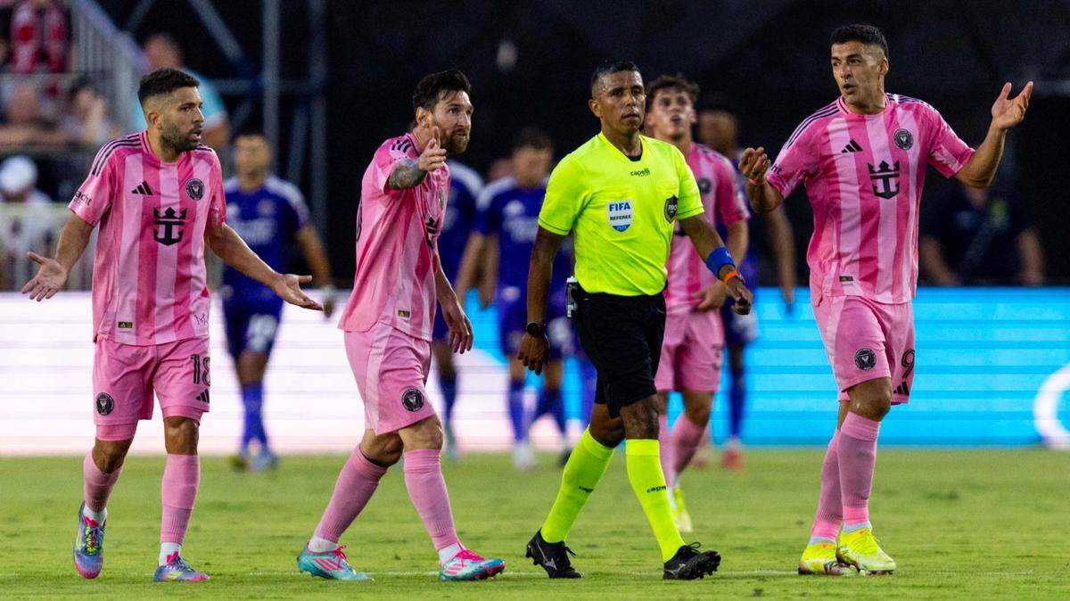 Inter Miami forward Lionel Messi (10), forward Luis Suárez (9) and defender Jordi Alba (18) speaks to a referee during the first half of an MLS match against the Orlando City at Chase Stadium on Sunday, May 18, 2025, in Fort Lauderdale, Fla.