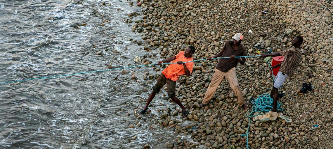 Men from the fishing community of Bodin on the outskirts of Port-de-Paix pull in a fishnet on March 24, 2022. Residents here say the lack of jobs and fish are among the reasons why some from the community recently took their chances trying to get to the Florida Keys on a boat carrying 356 migrants.