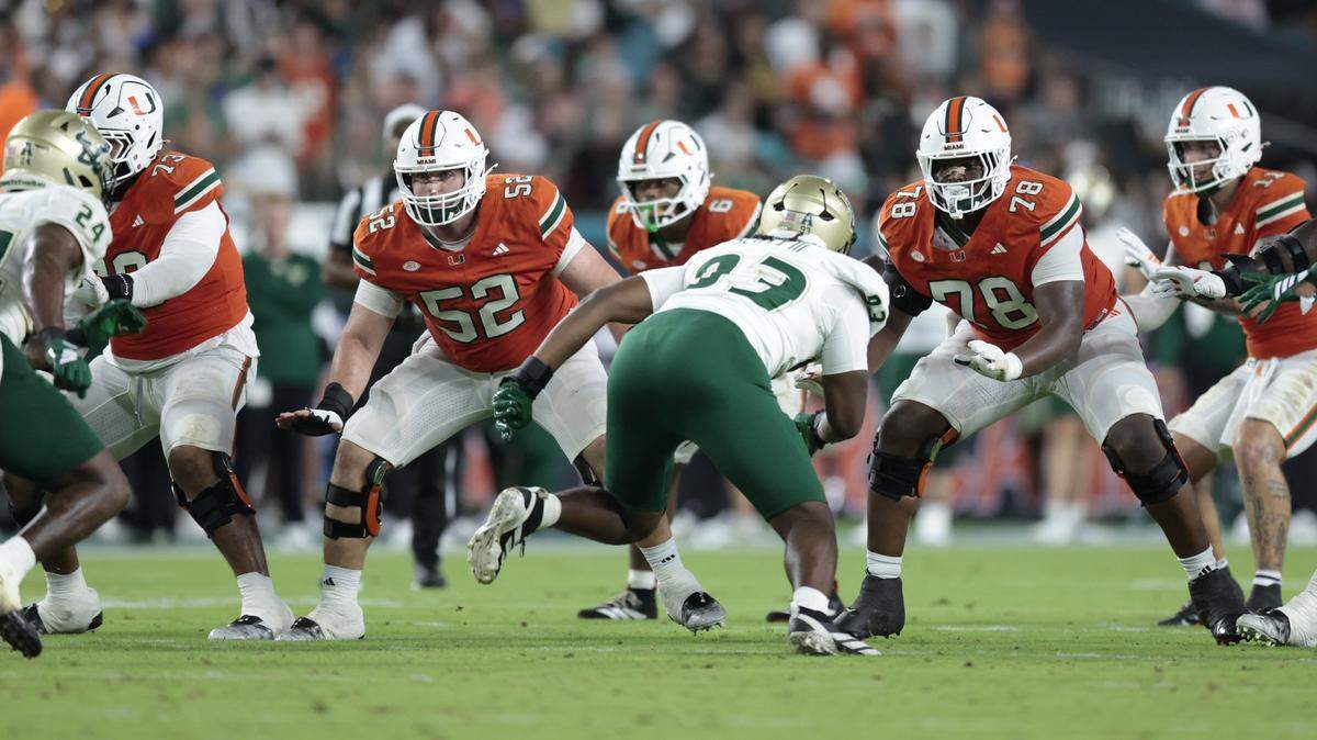 Miami Hurricanes offensive lineman Anez Cooper (73), offensive lineman James Brockermeyer (52) and Miami Hurricanes offensive lineman Matthew McCoy (78) set up to block during the NCAA football game against the South Florida Bulls at Hard Rock Stadium in Miami Gardens, Florida, on Saturday, September 13, 2025. 