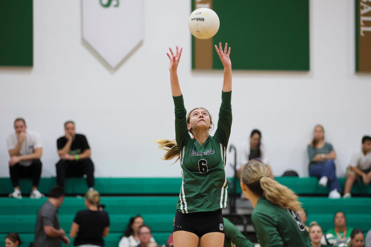 Westminster Christian Warriors setter Alyssa Cadavid (6) sets the ball against the Palmer Trinity Falcons during the third set of a volleyball Region 4-3A quarterfinal playoff match at Westminster Christian School in Palmetto Bay, Florida, Tuesday, October 24, 2023.