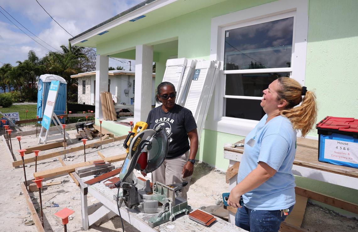 Maribel Gonzalez, right, laughs as Juana Sanchez works on a new Habitat for Humanity of Greater Miami house for her daughter in the South Miami-Dade neighborhood of Goulds. Gonzalez has been working on her own home next door as part of the nonprofit’s annual Blitz Build, which will see eight houses finished. The Miami Habitat affiliate recently marked 30 years in operation.