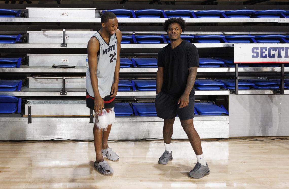 Andrew Wiggins (22) laughs with Davion Mitchell (45) during the first day of Miami Heat Training Camp on Sept. 30, 2025, at Florida Atlantic University in Boca Raton.