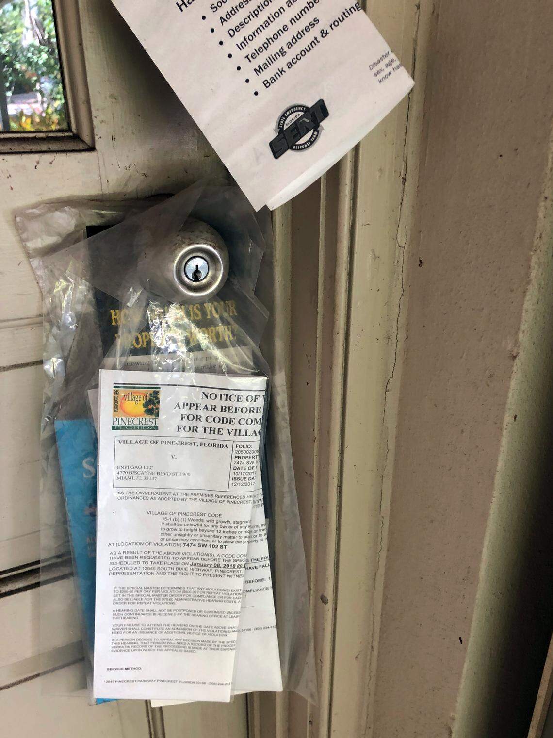 Code violations on the door of 7474 SW 102 St.