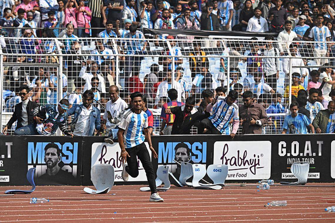 Fans react as Inter Miami's Argentine forward #10 Lionel Messi departs from the Salt Lake Stadium in Kolkata on December 13, 2025. Thousands of fans packed into a stadium in eastern India on December 13 to cheer on Lionel Messi as the football legend unveiled a 21-metre (70-foot) statue of himself. (Photo by Dibyangshu SARKAR / AFP via Getty Images)
