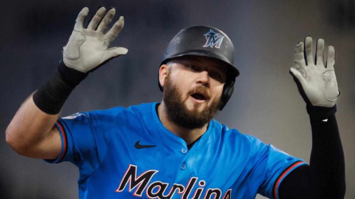 Miami Marlins third baseman Jake Burger (36) puts his hands up after hitting a two run home run during the second inning of a baseball game against the San Diego Padres on Sunday, Aug. 11, 2024, at loanDepot Park in Miami.