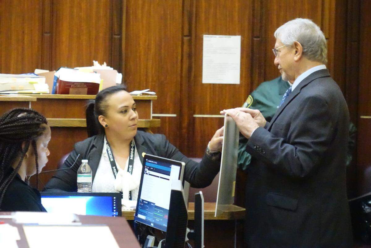 Miami-Dade Detective Alexandra Turnes points to an exhibit held by prosecutor Michael Von Zamft on Sept. 22, 2022. She testified during a hearing for Devonte Barnes, who is accused of taking part in a mass shooting at a Northwest Miami-Dade banquet hall on May 30, 2021.