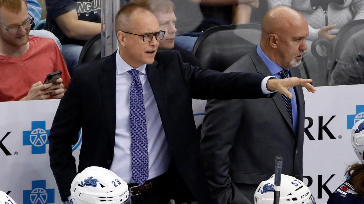 Winnipeg Jets head coach Paul Maurice, left, and assistant Charlie Huddy, right, stand behind their bench during the third period of an NHL hockey game against the Pittsburgh Penguins in Pittsburgh, Tuesday, Oct. 8, 2019. The Jets won 4-1. (AP Photo/Gene J. Puskar)