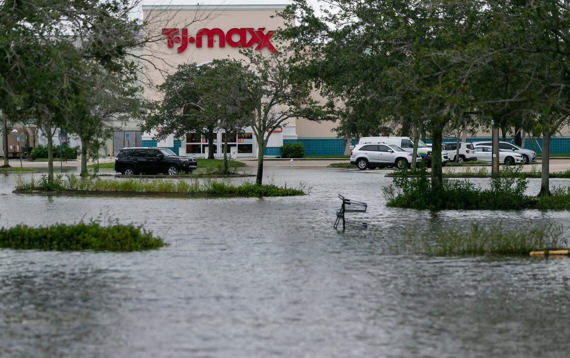 A flooded parking lot can be seen near T.J. Maxx in Sawgrass Mills Mall in Sunrise on Monday, Nov. 9, 2020. Tropical Storm Eta made its way past South Florida Sunday night, leaving roads and neighborhoods flooded.