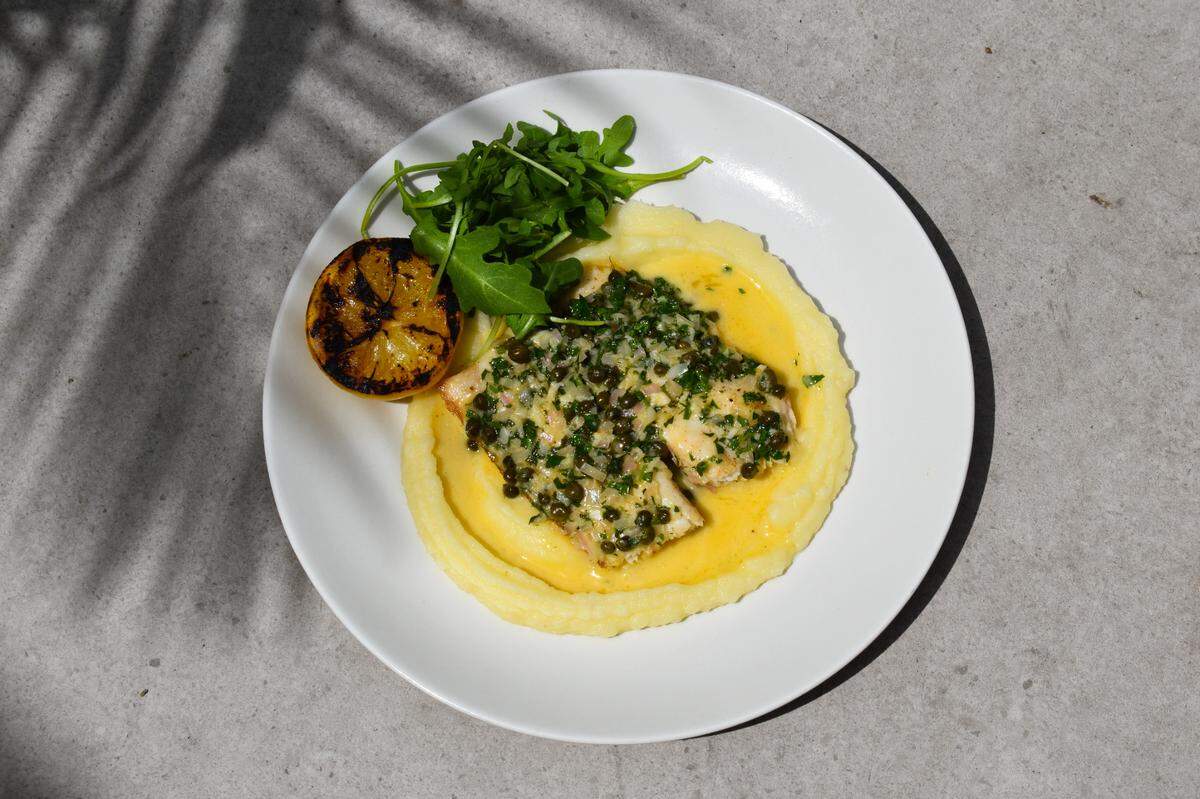 Wood roasted cobia Meuniere at Michael’s Genuine is an ample fillet sauced with brown butter and lemon.