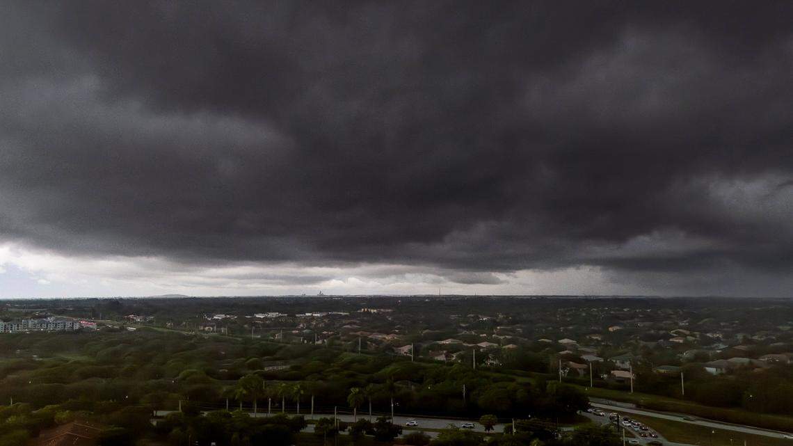 Rain makes its way over a neighborhood on Monday, July 14, 2025, in Miramar, Fla.