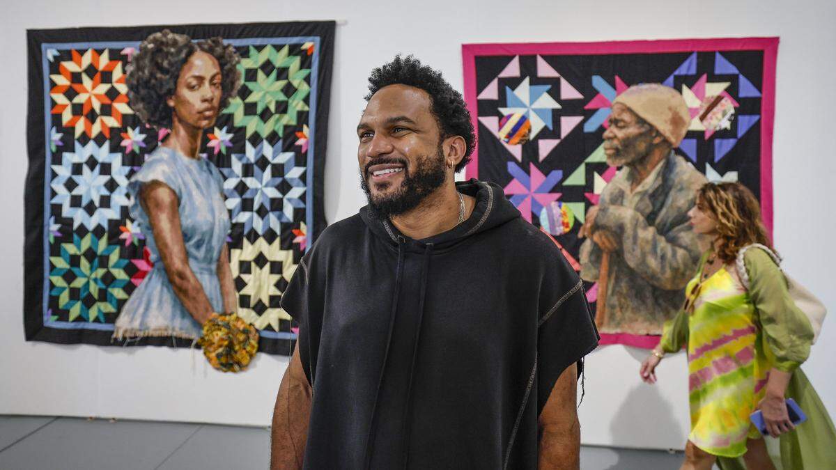 Kickstarter CEO, Everette Taylor, walks the halls and views the art work on display at the SCOPE Art Fair in Miami Beach, Florida on Friday, December 5, 2025.