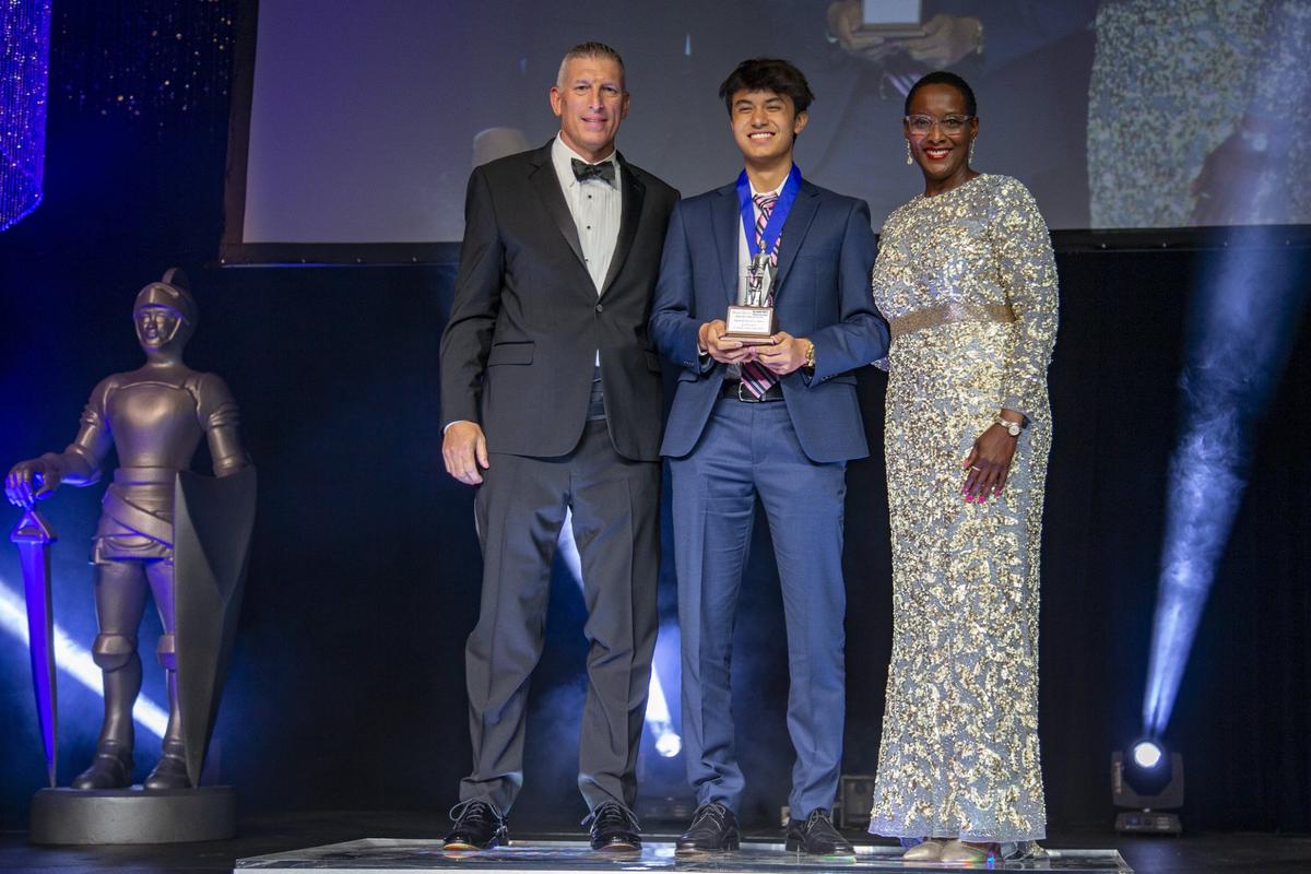 Justin Ruf, who won the Broward Silver Knight in Digital and Interactive Media, receives his award from Miami Herald and el Nuevo Herald General Manager Bob McFarlin and Monica Richardson, executive editor of the Miami Herald and el Nuevo Herald. He is a senior at St. Thomas Aquinas High in Fort Lauderdale.