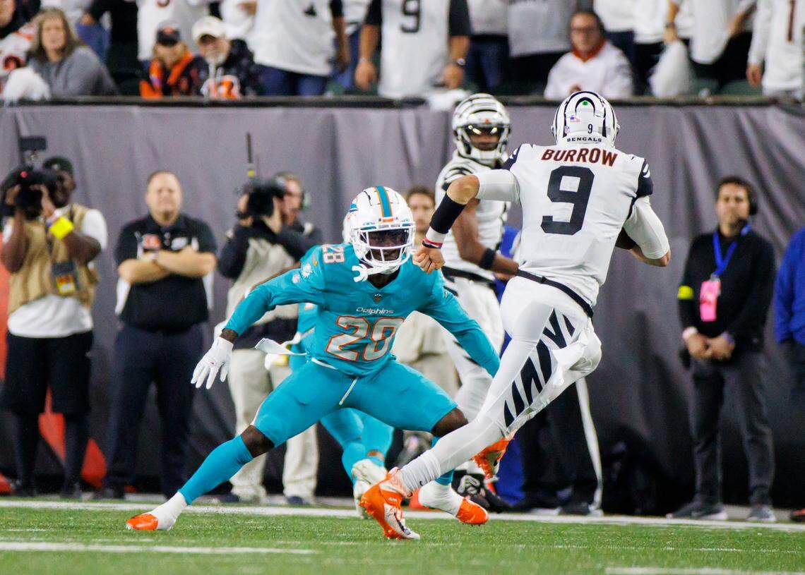 Miami Dolphins cornerback Kader Kohou (28) defends Cincinnati Bengals quarterback Joe Burrow (9) during the second quarter of an NFL football game at Paycor Stadium on Thursday, September 29, 2022 in Cincinnati, Ohio.
