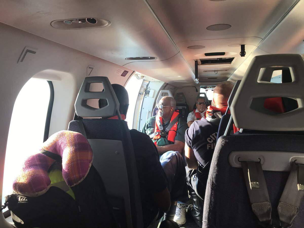 Miami-Dade Commissioner Dennis Moss onboard a helicopter flying over Great Abaco Island on Friday, Sept. 6, 2019, to survey damage from Hurricane Dorian.