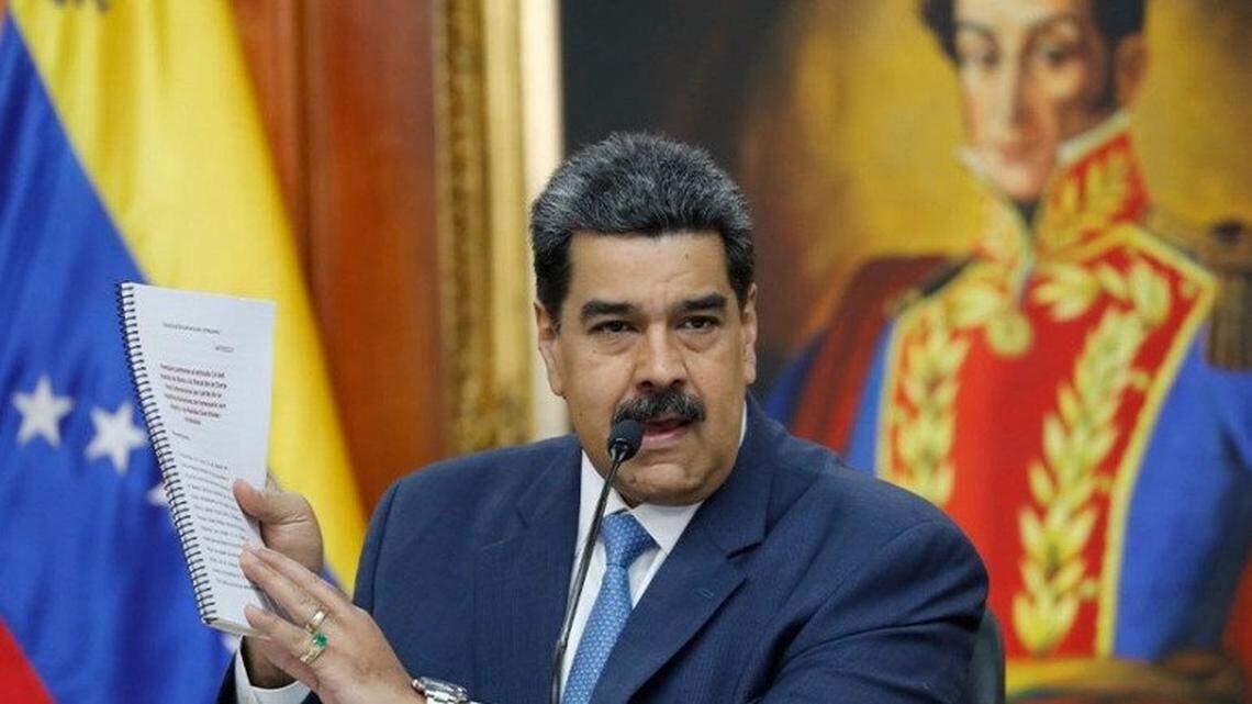 In 2020, Venezuelan leader Nicolas Maduro holds a copy of his country’s case taken to the International Criminal Court regarding U.S. sanctions.