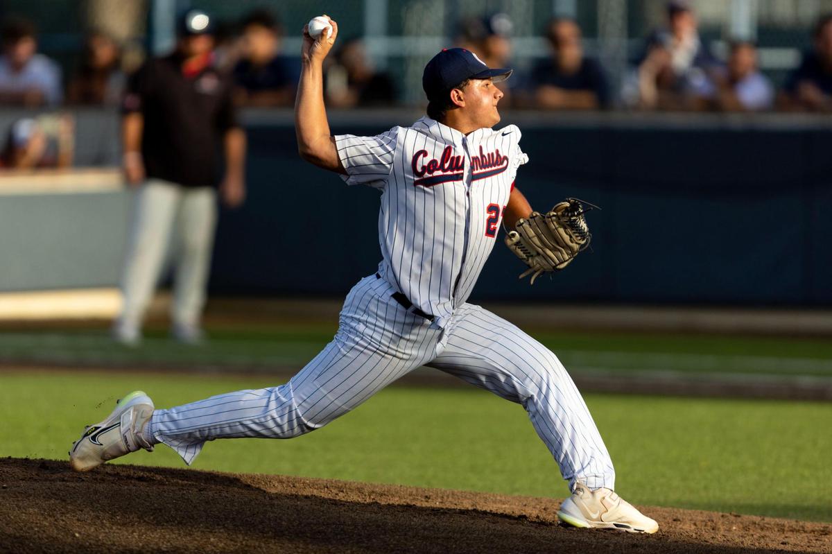 Columbus pitcher Jason Vasquez (27) throws the ball during the first inning of a high school baseball game against Marjory Stoneman Douglas at Columbus High School in Miami, Florida, on Friday, March 24, 2023.