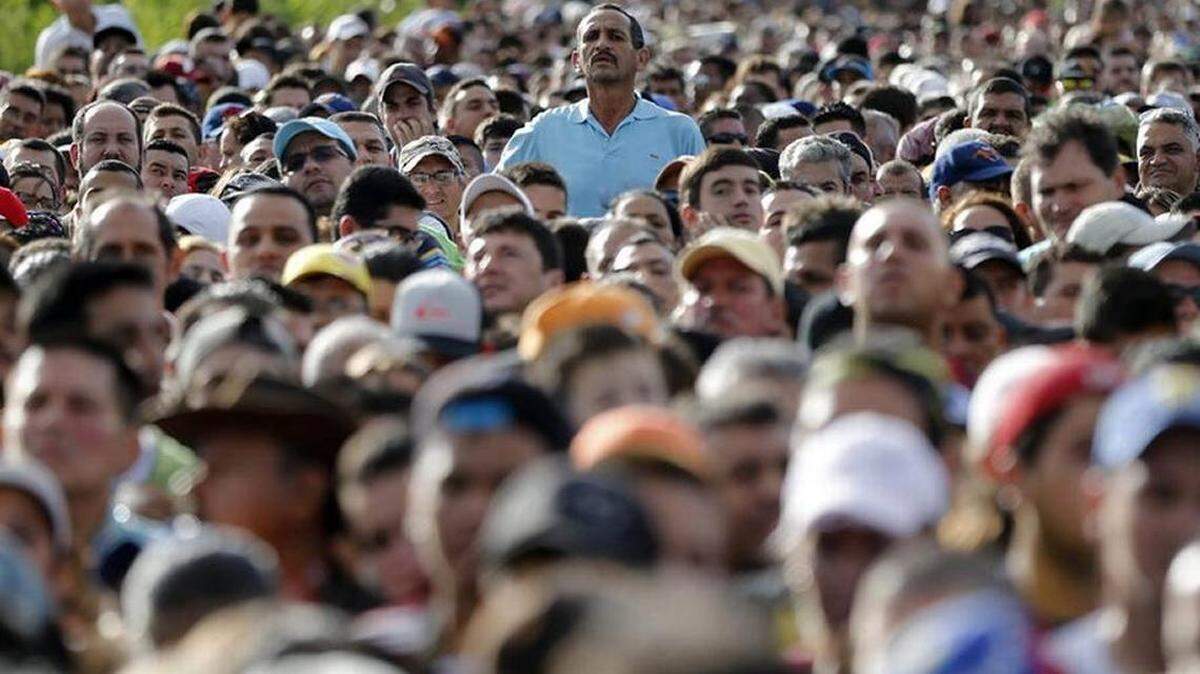In 2016, a crowd of Venezuelans waited to cross the Simon Bolivar Bridge into Colombia.