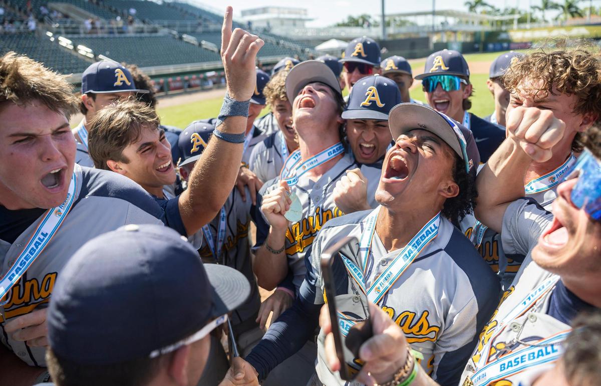 St. Thomas Aquinas Raiders second baseman Brad Sigler (12) celebrates with his teammates after defeating the Buchholz Bobcats in their Class 6A state baseball championship game at Hammond Stadium on Saturday, May 17, 2025, in Fort Myers, Fla.