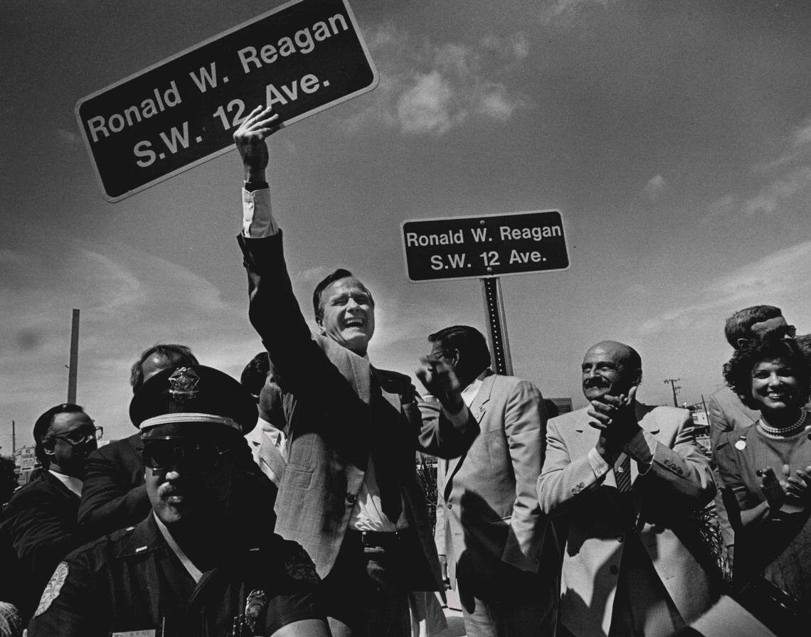In 1987, Vice President George Bush displays a street sign in Little Havana. Southwest 12th Avenue was named for President Ronald Reagan.