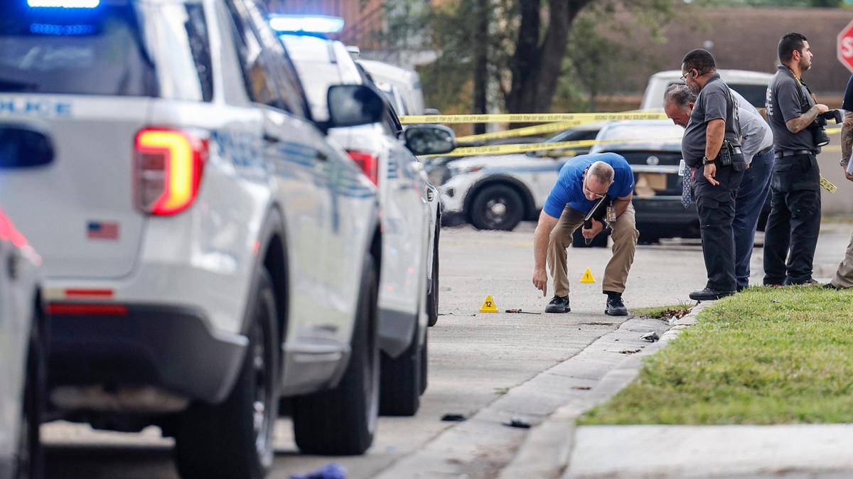 Miami police crime scene investigators gather evidence at the scene of a residence near Northwest Seventh Court and 58th Street in Miami, Florida on Thursday, March 7, 2024, after Miami police shot a man standing on a porch multiple times The man was in critical condition in the hospital on Thursday evening.