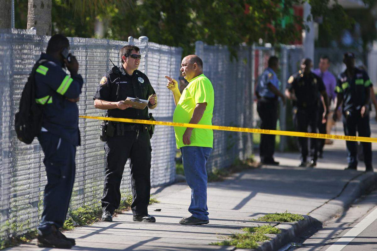 Miami Police Department at the scene after a school bus and a garbage truck collided on Northwest 12th Avenue and 71st Street on Thursday, September 19 2019, in Miami.