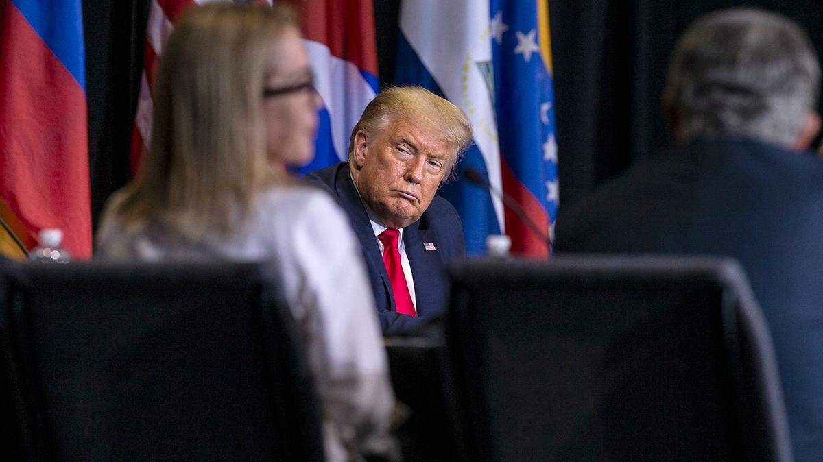 U.S. President Donald Trump listens as a group of members from the Venezuelan and the Cuban exile communities talk about the situation in their countries under socialist regimes during a meeting at Iglesia Doral Jesus Worship Center after he visited the U.S. Southern Command in Doral, Fla., on Friday, July 10, 2020.
