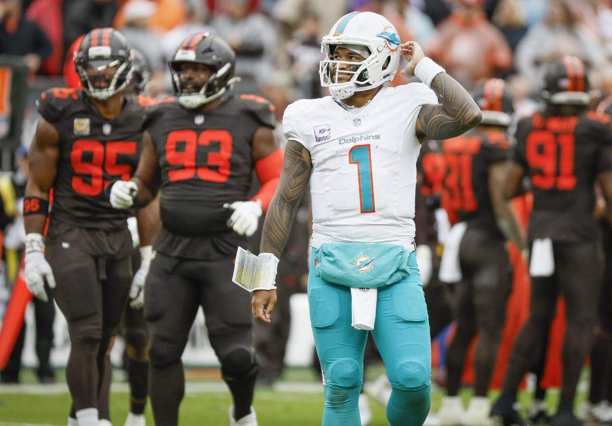 Miami Dolphins quarterback Tua Tagovailoa (1) looks towards the score board after an interception during the second half of an NFL football game against the Cleveland Browns at Huntington Bank Field in Cleveland, Ohio, on Sunday, October 19, 2025.