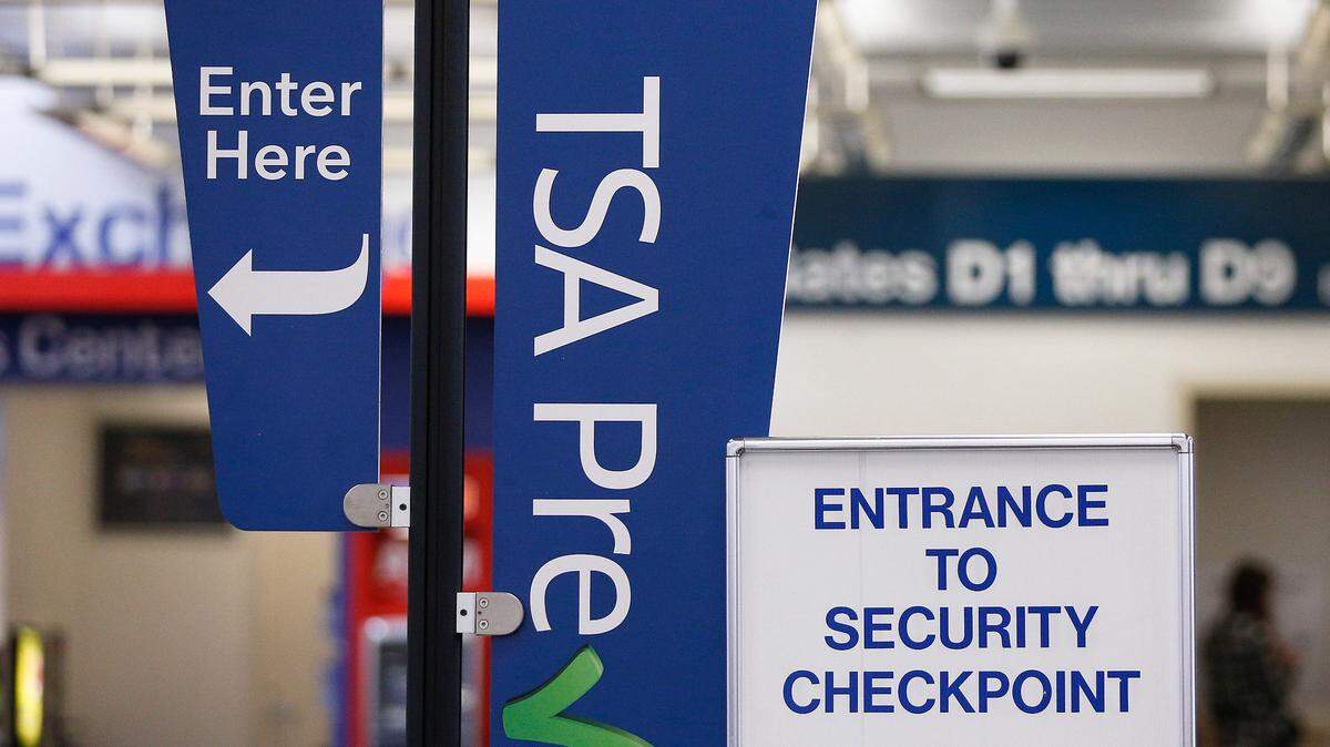 A TSA pre check sign at a security checkpoint is on display for travelers to easily see at the Fort Lauderdale–Hollywood International Airport in this file photo.