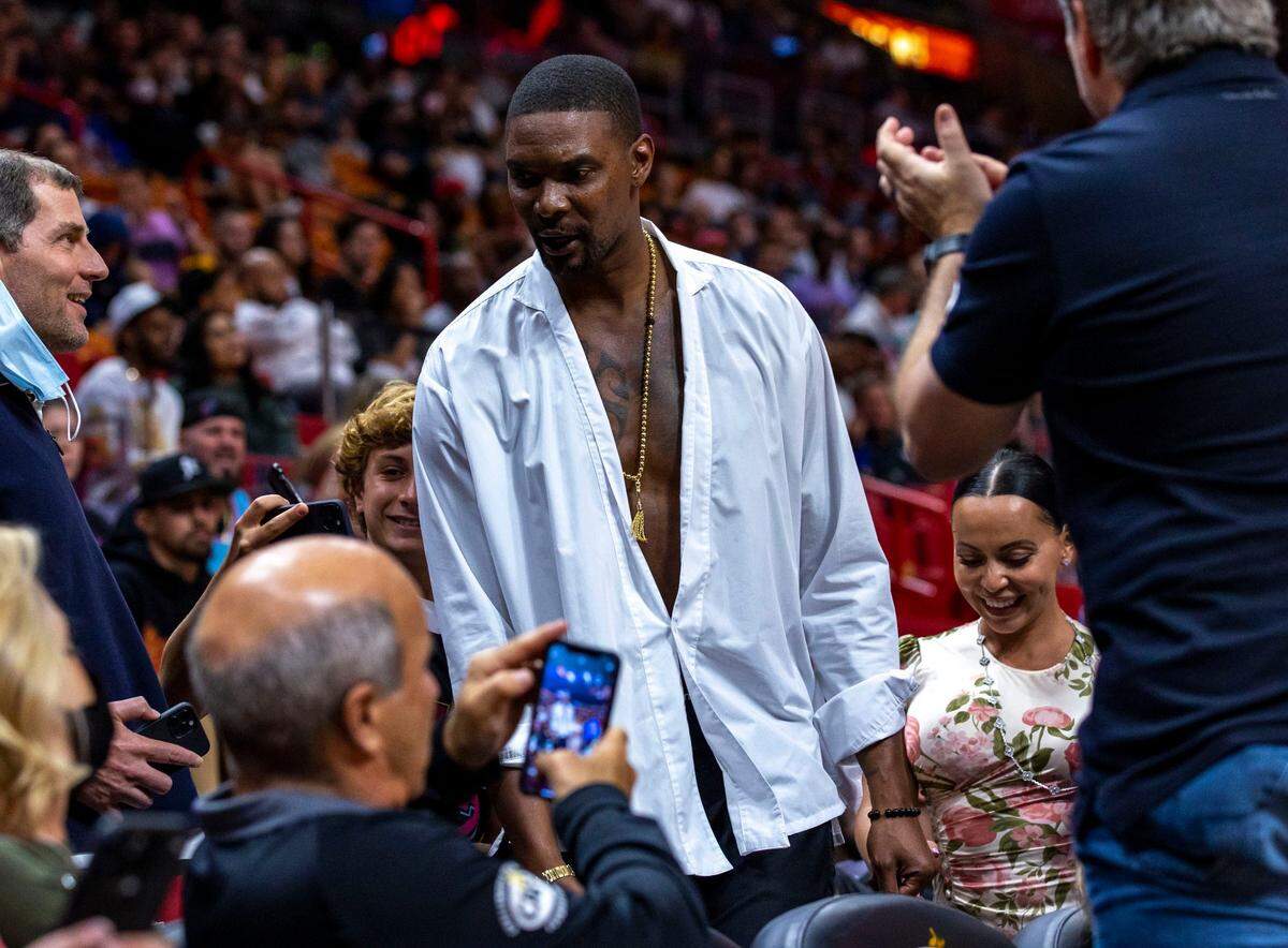 Former Miami Heat All-Star Chris Bosh leaves the game early during the fourth quarter of an NBA game between the Miami Heat and the Brooklyn Nets at FTX Arena in Downtown Miami, Florida, on Saturday, March 26, 2022.
