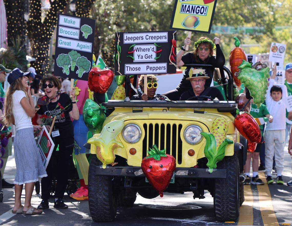 A group representing the Coconut Grove Food Pantry parades north on Main Highway while bring awareness to their public service.  The 42nd Annual King Mango Strut on Sunday, January 4, 2026, in the heart of the Grove in Miami, Florida. 