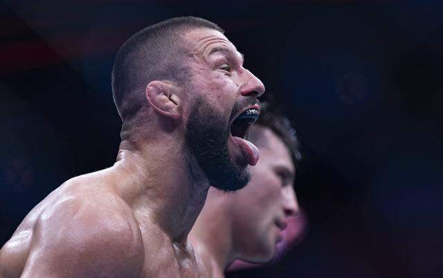 Mateusz Gamrot of Poland reacts after defeating Esteban Ribovics of Argentina in their lightweight bout at UFC 327 at the Kaseya Center on Saturday, April 11, 2026, in downtown Miami, Fla.