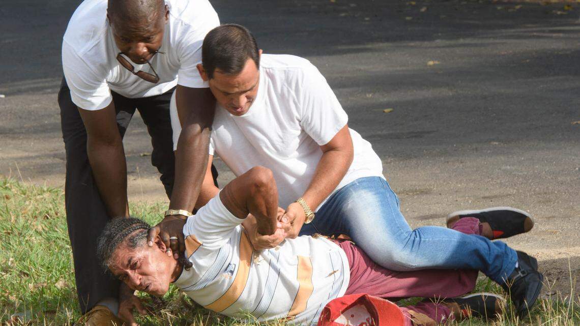 In 2016, Cuban authorities restrain a man on the ground before releasing him moments later as authorities arrest independent journalist Lazaro Yuri Valle Roca.