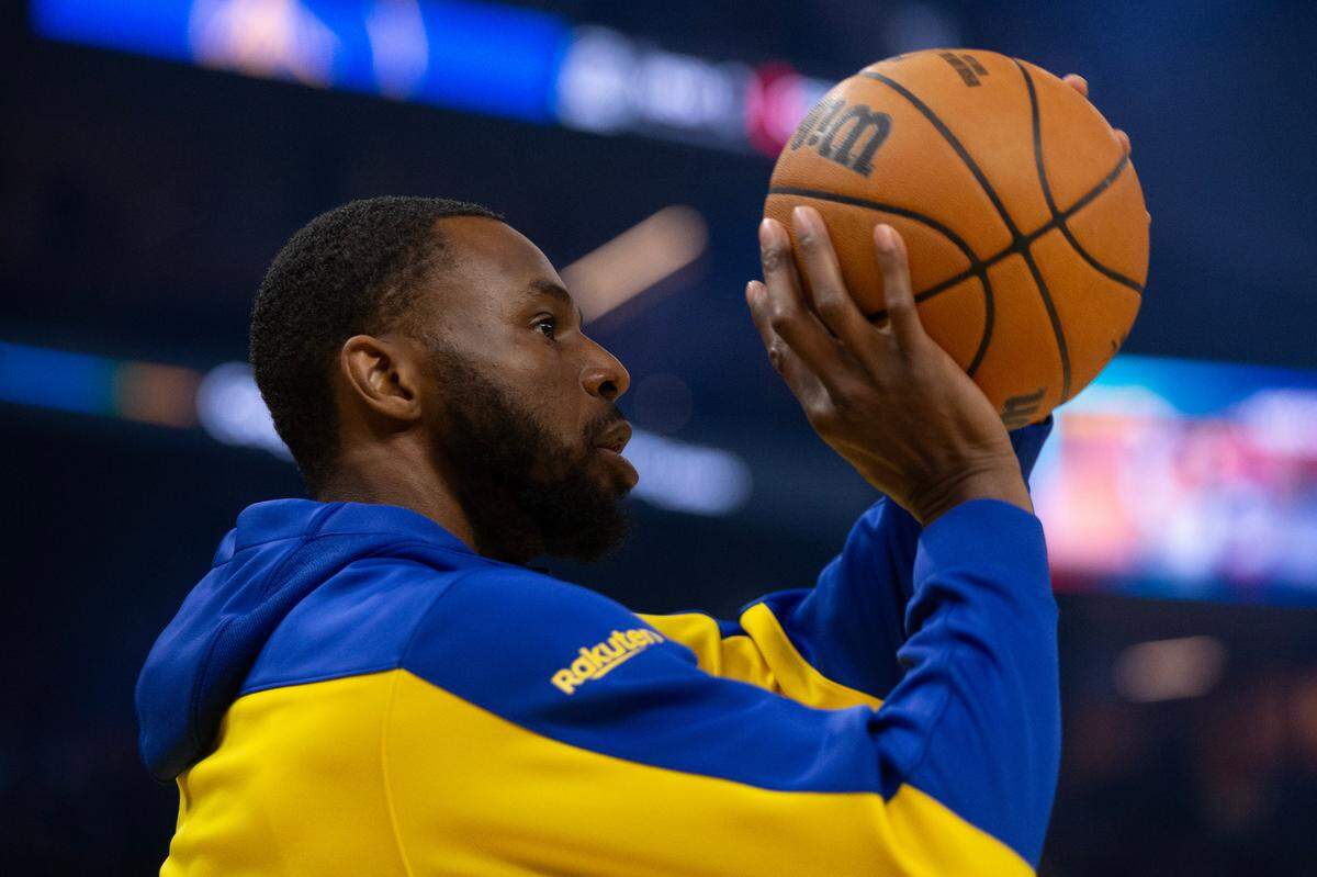 Golden State Warriors forward Andrew Wiggins warms up before taking on the Utah Jazz at Chase Center.